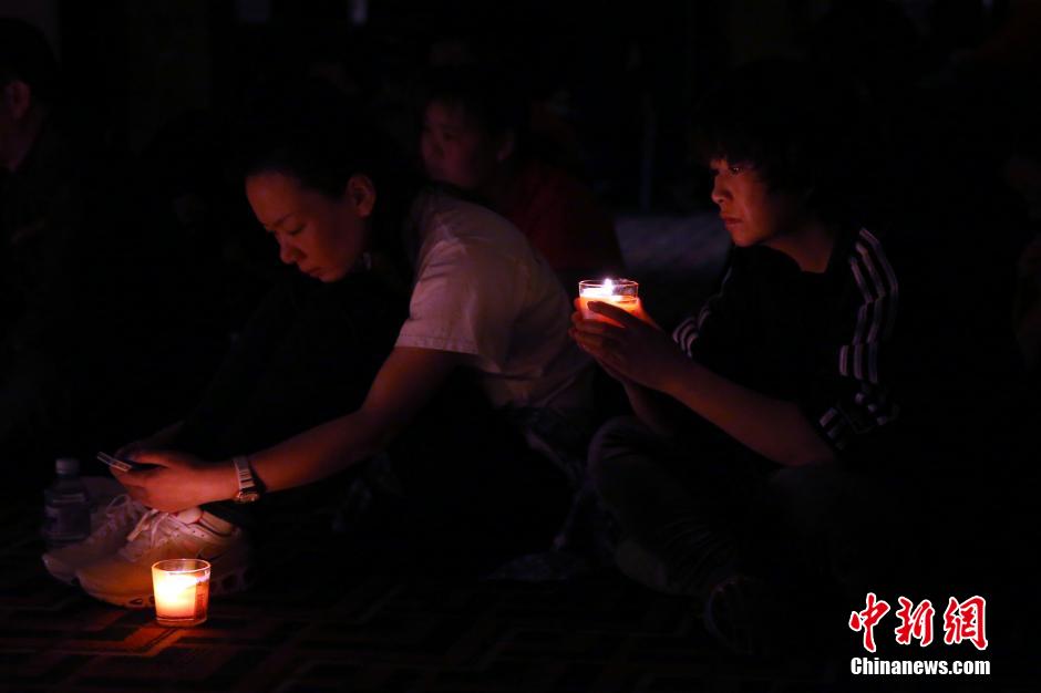 MH370航班失聯(lián)滿月 在京乘客家屬舉行祈?；顒?dòng)