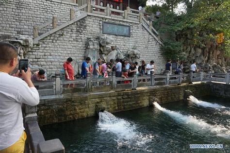 Torrential gush seen at Heihu Spring in E China's Jinan